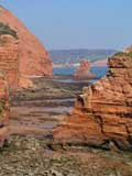 Red cliffs at Ladram Bay looking towards Sidmouth - Photography by Tom Hurley